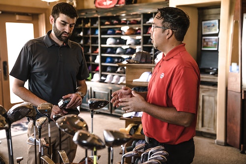 Talking to customer in bikeshop.