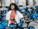 Woman taking Mobility-as-a-Service ridesharing E-bike