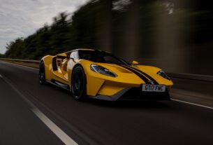 Yellow autonomous driving car on road