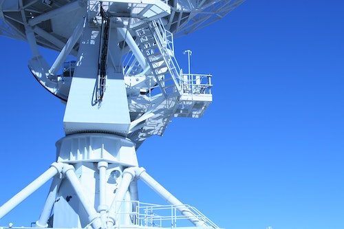 Radio tower on blue background